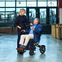 Man using the Golden Stride GP301 power wheelchair in a public atrium