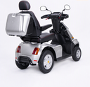 Silver Afiscooter S4 with the Afikim SUV kit, rear three-quarter view: black tubular rear bumper, all-terrain tires and silver rear storage box.