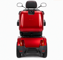 Rear view of a red Afiscooter S4 with the Afikim SUV kit: black tubular rear bumper below the tail lights, all-terrain tires and the rear storage box.