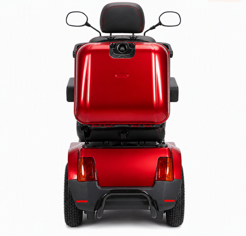 Rear view of a red Afiscooter S4 with the Afikim SUV kit: black tubular rear bumper below the tail lights, all-terrain tires and the rear storage box.
