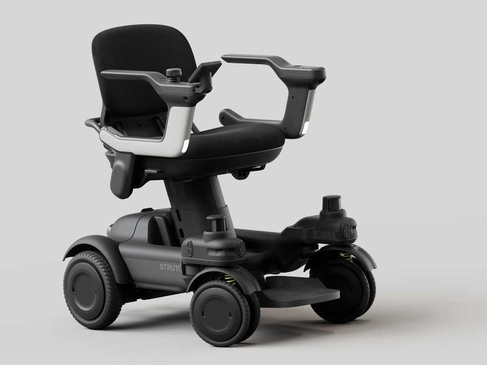 Strutt ev¹ smart power chair, front three-quarter studio view showing the seat, both armrests, footplate and four wheels