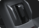 Close-up of the grey housing at the rear of the WHILL Model C Lite showing a locking switch and a lever handle.